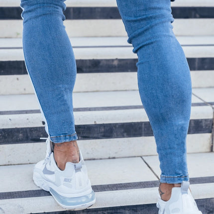 Wholesale Men's White Slim Fit Ripped Paint Webbing Skinny Jeans