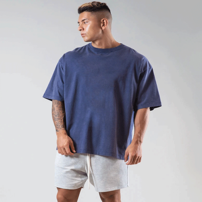 Camiseta de manga corta holgada deportiva informal con cuello redondo para hombre