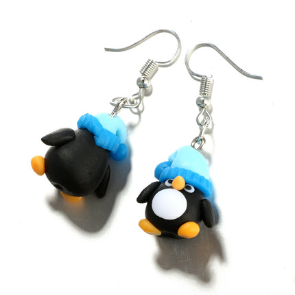 Kreative kleine Pinguin-Ohrringe aus weicher Keramik