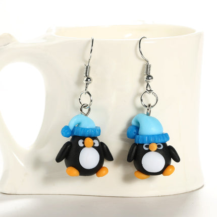 Pendientes creativos de cerámica blanda con el pequeño pingüino