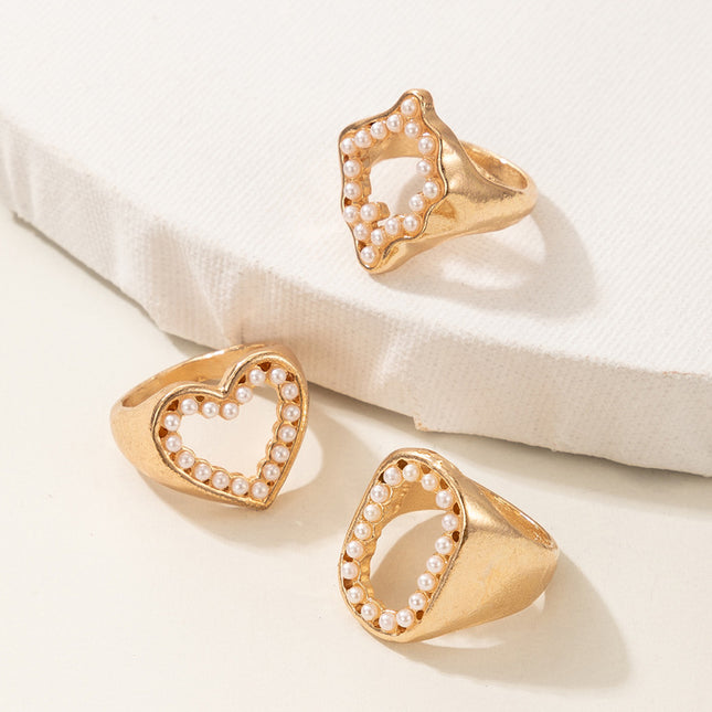 Venta al por mayor de moda hueco con incrustaciones de perlas letra O anillo de corazón 3 piezas