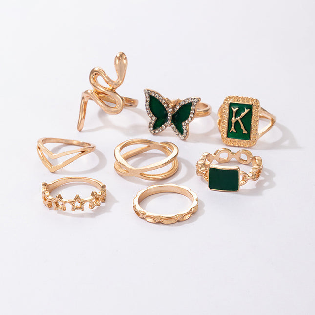 Anillo de mujer de 8 piezas con pentagrama de mariposa y serpiente con letra K verde dorado