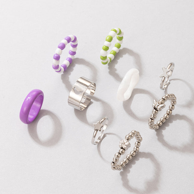 Großhandelsreis-Perlen-Acrylring-Silber-Blumen-Ring-neunteiliges Set