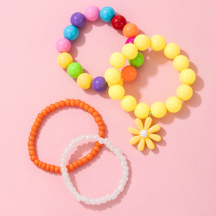 Conjunto de pulsera de cuatro piezas de color caramelo divertido para niños con cuentas de margaritas pequeñas