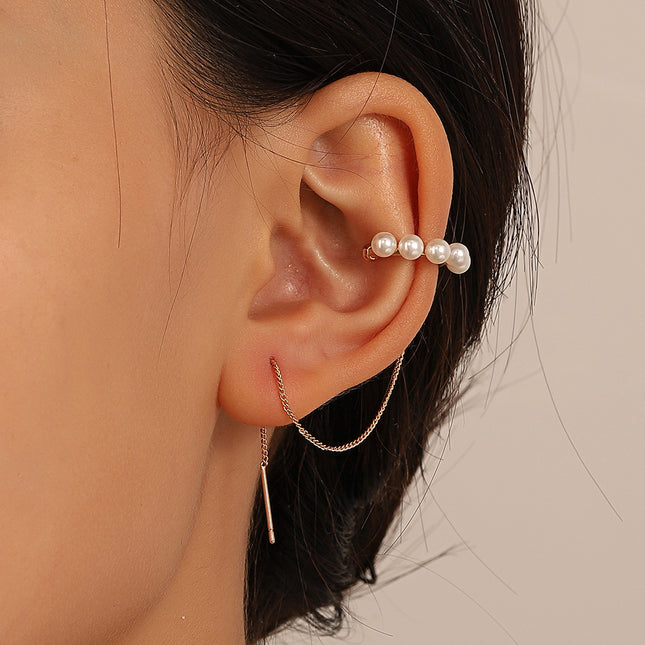 Pendiente único de alambre de oreja de borla larga con clip de hueso del oído de perla