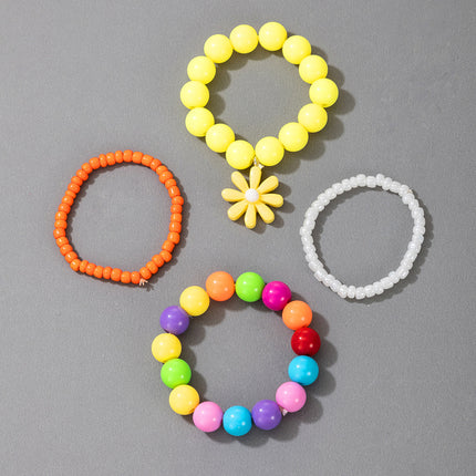 Conjunto de pulsera de cuatro piezas de color caramelo divertido para niños con cuentas de margaritas pequeñas