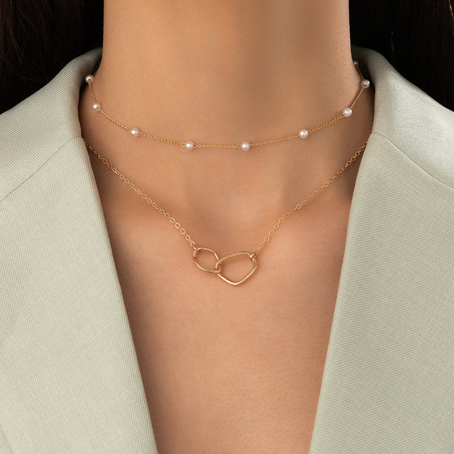 Collar doble de cadena de perlas con cruz geométrica