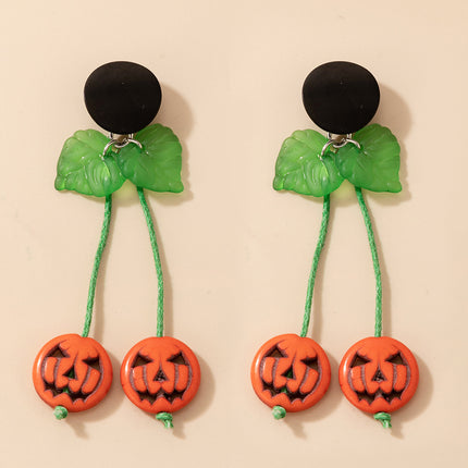 Pendientes de lazo pintados con diseño de calavera de Halloween
