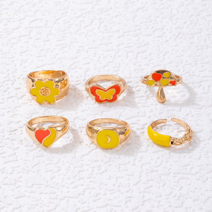 Buntes Öltropfen-Schmetterlings-Blumen-Set mit sechs Ringen