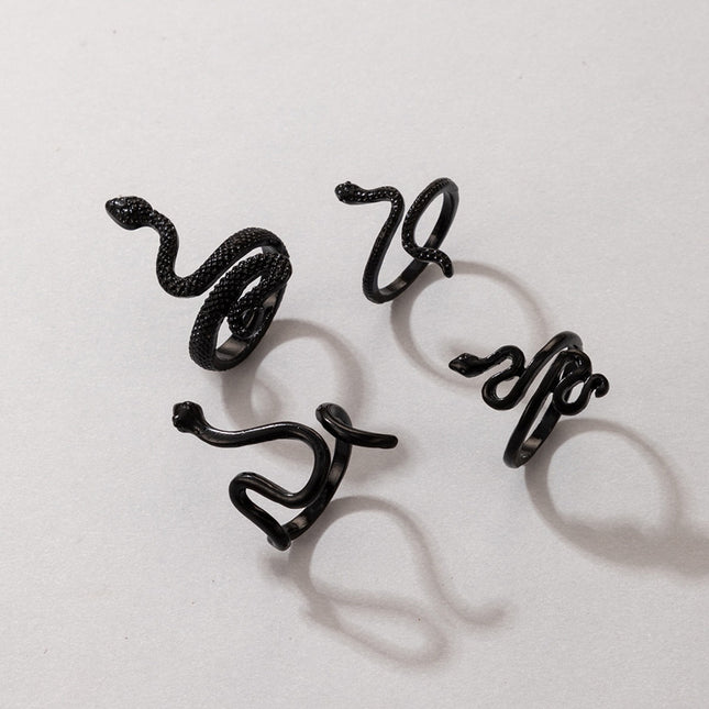 Juego de anillos de cuatro piezas con varias serpientes hechas con animales de serpiente